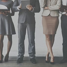 Employees dressed in business professional attire